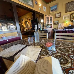 an open book and a glass of water