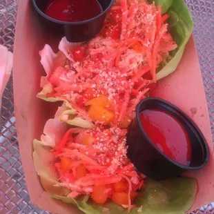Smoked chicken lettuce wraps with carrots and hemp seeds