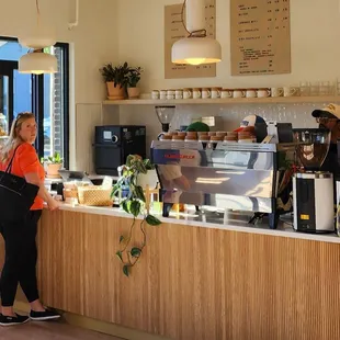 Front counter and some side eye, lol. Loved the pop of color from her blouse though! (5/11/24)