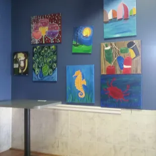 Paint nite paintings on stage