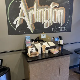 a coffee shop with a chalkboard sign