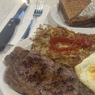 steak, eggs, hash browns, and toast