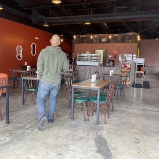 a man standing in a coffee shop