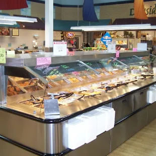 Stop by our deli for a fresh, hot rotisserie chicken. Now featuring a hot food, fresh salad, and soup bar...