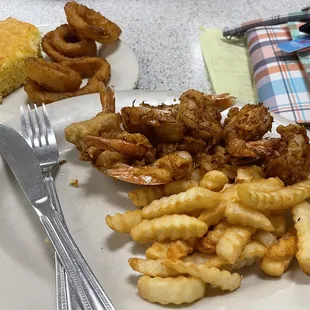 Beer battered shrimp with fries, onion rings, and cornbread. The shrimp are huge! Not pre-breaded either!