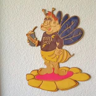 a lady bee holding a drink