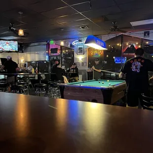 a pool table in a sports bar