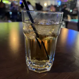 a drink in a glass on a table