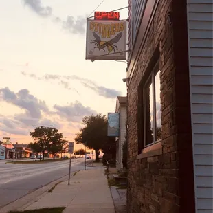 a brick building with a sign for stingers