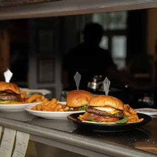 three plates of food on a counter