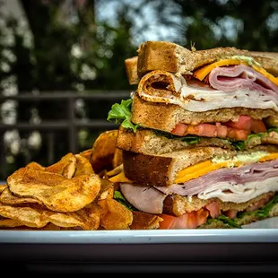 a sandwich and chips on a plate