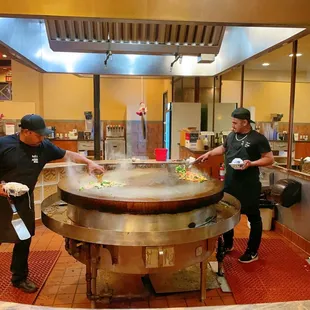 two men preparing food