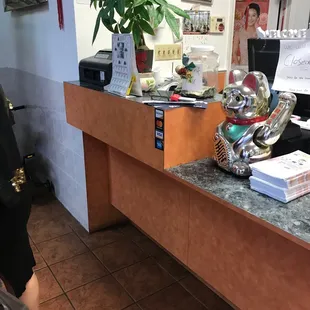 a woman standing in front of a counter
