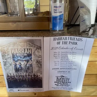 a bottle of harrah friends of the park vodka and a poster of the harrah friends of the park