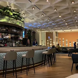 a bar with a lot of chairs and tables