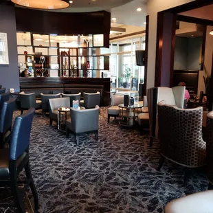 a bar and lounge area in a hotel