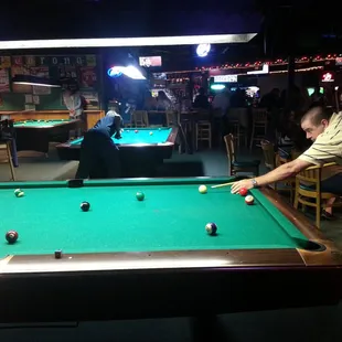 a man playing pool