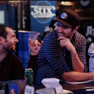 two men sitting at a table