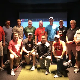 a group of men posing for a picture