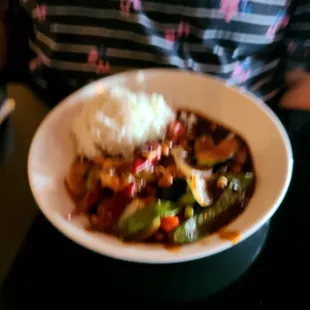 a plate of food with rice and vegetables