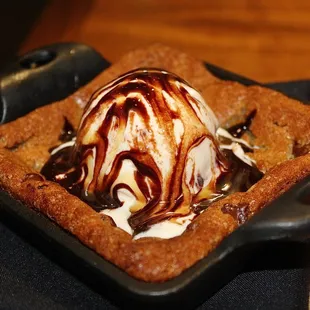The Warm Chocolate Chip Cookie was served with ice cream &amp; caramel sauce.