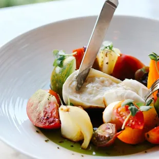 a plate of vegetables with a fork
