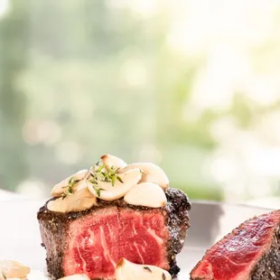 two steaks on a white plate