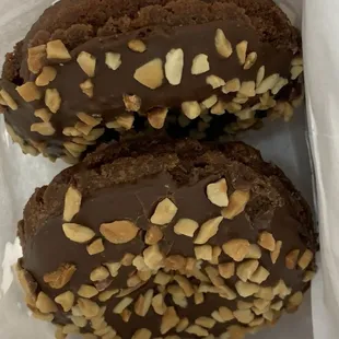 two chocolate covered donuts