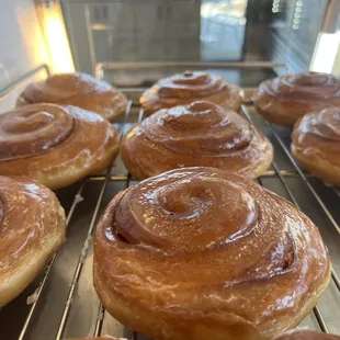 cinnamon buns on a cooling rack