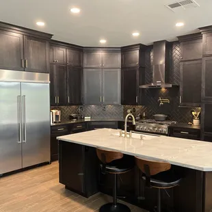 a large kitchen with a center island