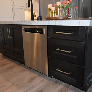 a kitchen island with a dishwasher