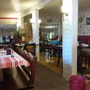 Inside the dining area is an old house, which is in part made up of the old living room and the front porch.