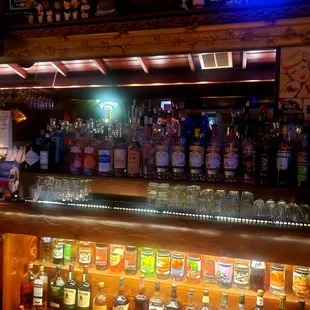 a bar filled with liquor bottles