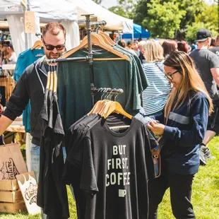 people shopping at a farmers market