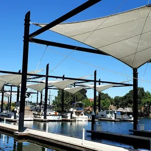 a row of sailboats docked at a marina