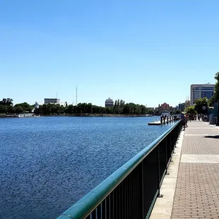 a view of a river with a bridge in the background