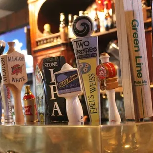 a row of beer taps