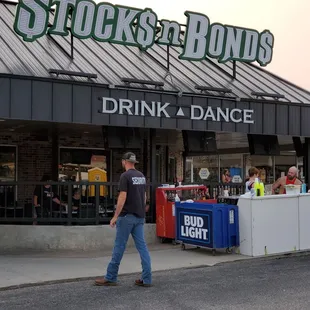 a man walking in front of a store