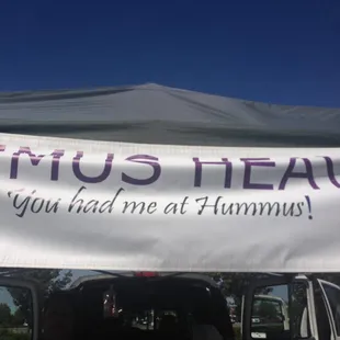  tent with a sign that says minus leave you had me at hummus