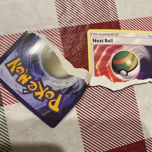 a pokemon card and a pokemon ball