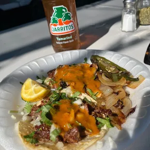 Tripas tacos and Jarritos