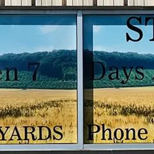 Sign out in front of the massive long building.