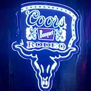 a neon sign of a cow skull