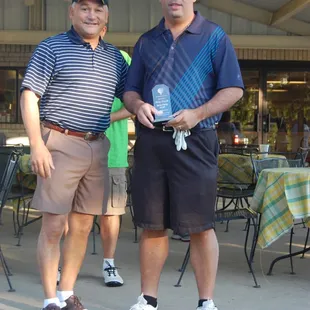 two men standing next to each other
