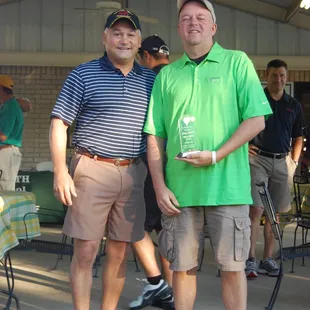 two men posing for a picture