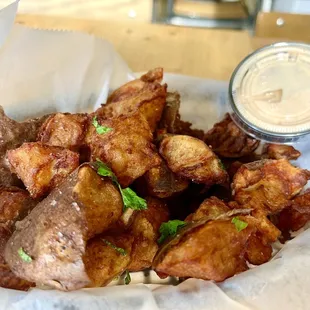 a basket of fried potatoes