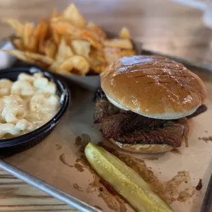 Brisket sandwich with a side of house made chips and Mac and cheese!!