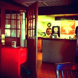 a coke machine in the foreground