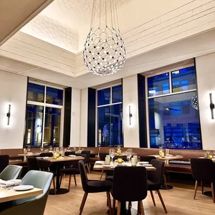 a dining room with tables and chairs