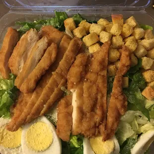 Caesar salad with crispy chicken added
